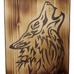 black wolf on wood